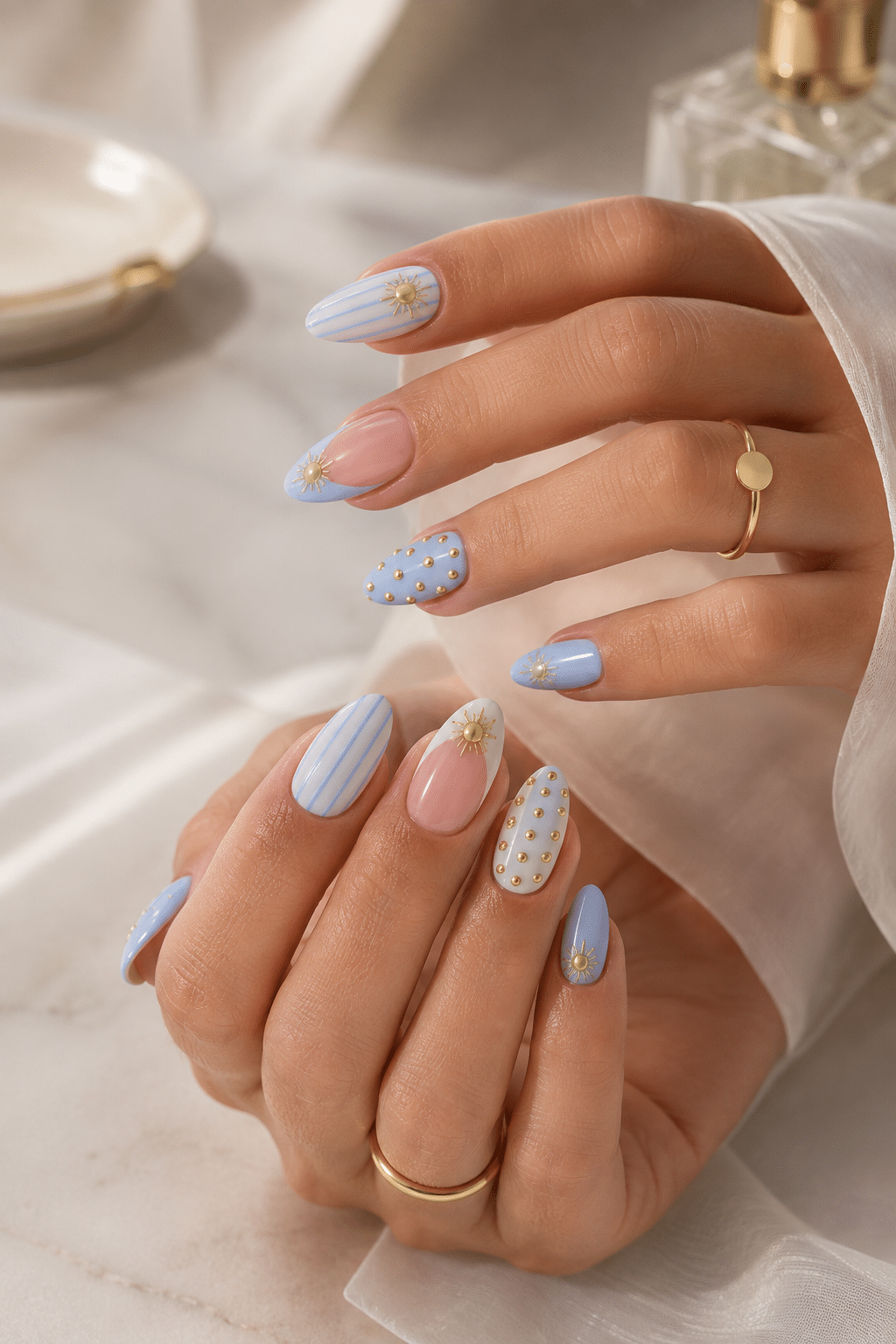 Soft Blue Sunburst Nail Ideas for an Elegant Gold-Accent Manicure 2 soft blue sunburst nail ideas